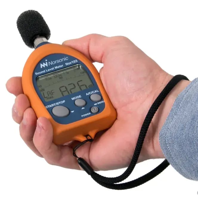 Nor103-sound-level-meter-in-hand-white-(664x664px)